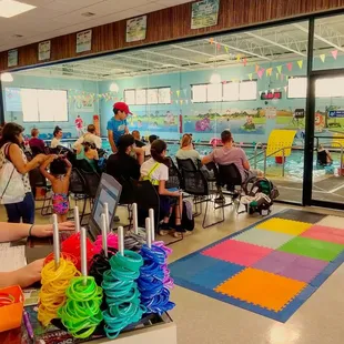All the parents watching the children learn to swim