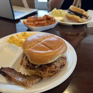 Pulled pork sandwich with Mac and cheese with one piece of Brisket.