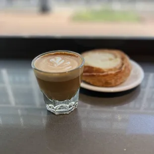 a cup of coffee and a sandwich