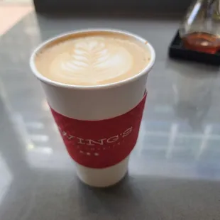 a cup of coffee on a table