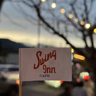 a swing inn sign
