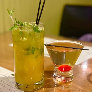 two cocktails on a wooden table