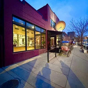 the outside of a restaurant at dusk