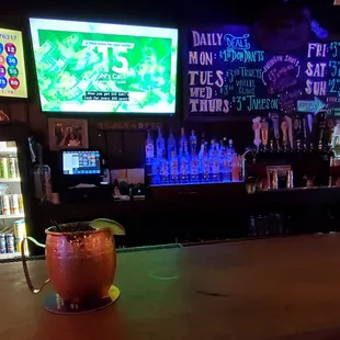 a bar with neon signs