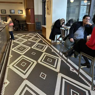 a group of people sitting at tables