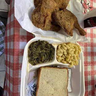 Fried chicken dinner with mac n cheese and greens.  Good flavor to all items.