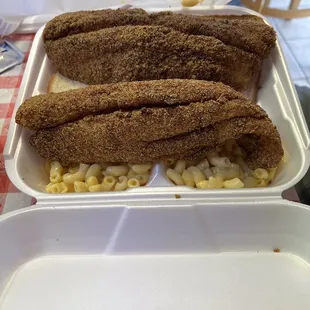 Catfish fillet dinner with mac n cheese and fried okra.