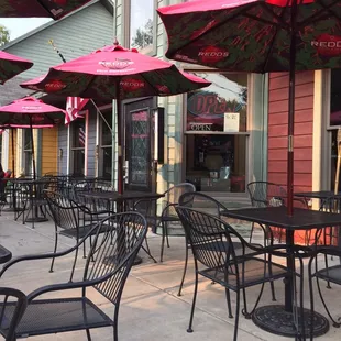 tables and chairs outside of a restaurant