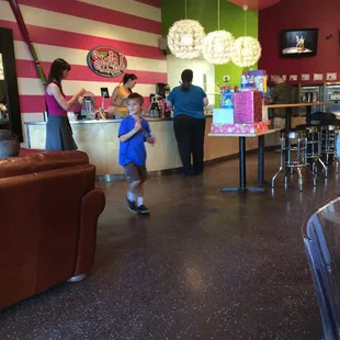 a toddler running towards the counter