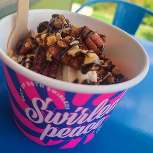 Pecan praline soft serve w/pecans, waffle cone pieces and chocolate drizzle
