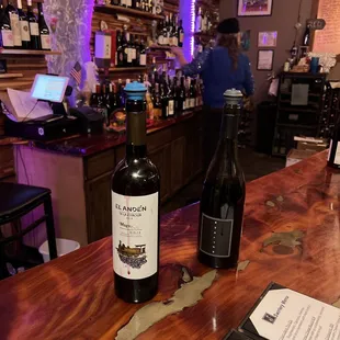 two bottles of wine on the bar