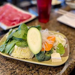 a plate of vegetables on a table