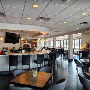 a view of a restaurant with tables and chairs