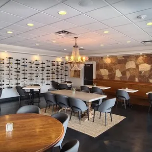 a dining area with tables and chairs