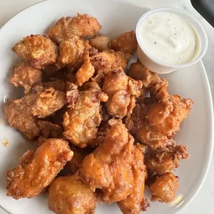 Buffalo cheese curds. Basically cheese curds tossed in buffalo sauce. Solid.