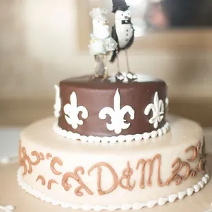 Our beautiful wedding cake: bottom tier was almond cake w/ hazelnut frosting in between. Most delicious cake I&apos;ve ever had!