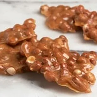 Peanut Brittle - The original brittle made with a generous portion of roasted peanuts.
