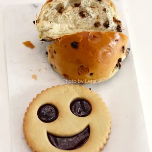 Smiley Face Linzer ($3) and inside of Chocoweggli ($2.50)