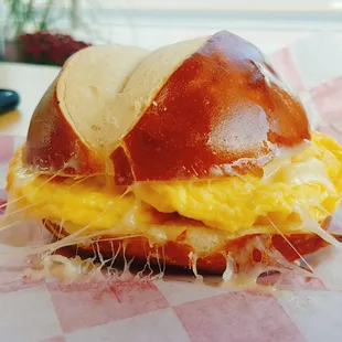 Egg and swiss cheese on a pretzel baguette