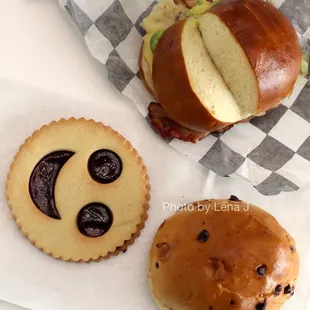 Bacon, Avocado, Egg &amp; Cheese ($6.75); Smiley Face Linzer ($3); Chocoweggli ($2.50)