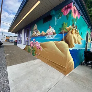 Beautiful painting next to outdoor seating.