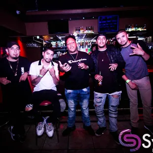 a group of men posing for a picture