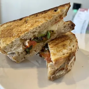 Brie &amp; Sweet Basil Sandwich --  Melted French brie cheese, blistered cherry tomatoes, fresh basil, crushed red peppers and wildflower honey