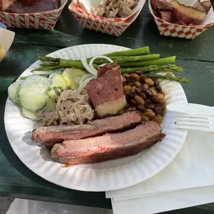The feast! Brisket, pulled pork, ribs, asparagus, cuke salad, baked beans. First plateful!