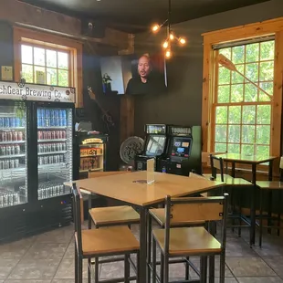 Seating area in taproom and cans to go.