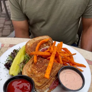 a grilled cheese sandwich and fries