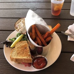 Beef Reuben with sweet potato fries and German potatoe salad.