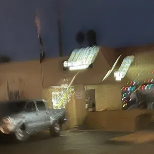 a blurry view of a street at night