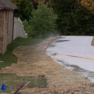 Crossing the property line to build up the ground for the new home. Cutting up established grass.