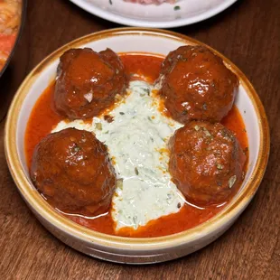 a bowl of meatballs with sauce