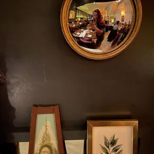 a framed picture of a woman in a restaurant