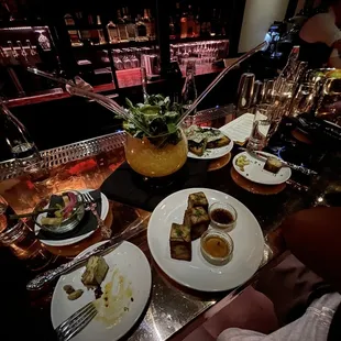 plates of food on a bar