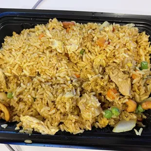 a tray of rice and vegetables