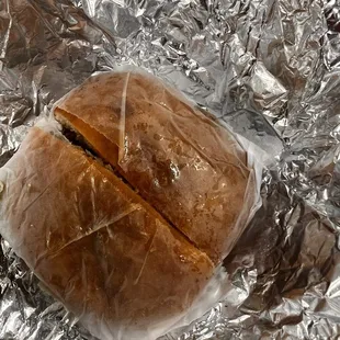 a loaf of bread wrapped in tin foil