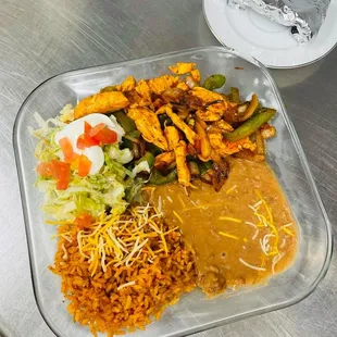 Lunch, chicken, fajita choice of steak or chicken server with rice, refried beans, sour cream, and salad come with  tortillas flower or corn