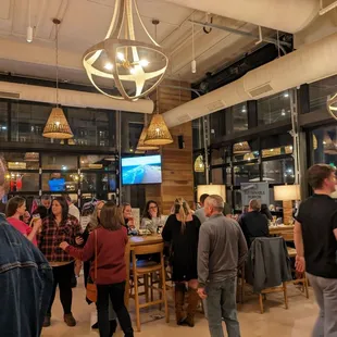 a crowd of people at a bar