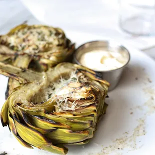 a plate of artichokes on a table
