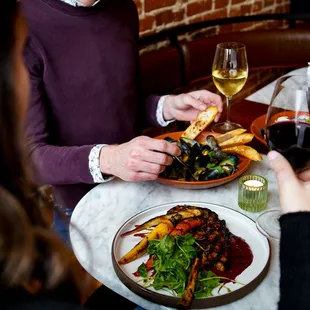 a man and a woman sharing a meal