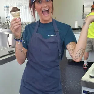 a woman holding an ice cream cone