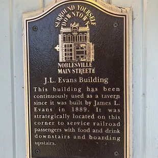 a plaque on the side of a building