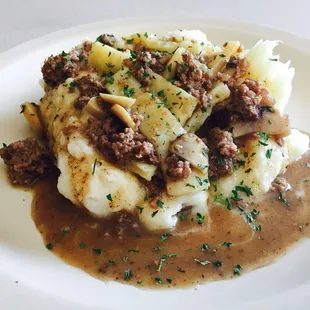 Beef and noodles over mashed potatoes