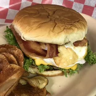 Don't have time for breakfast? Why not put an egg on our bacon cheese burger?! Problem solved