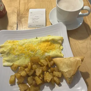 Eggs, potatoes, samosa and Hot Chocolate