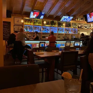 people sitting at a bar