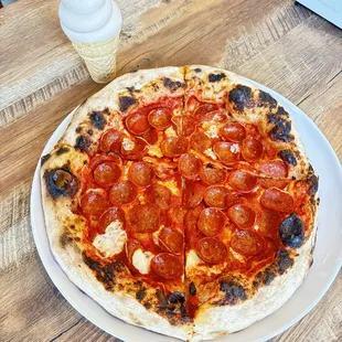 Famous pepperoni pizza with their in house made churro ice cream.