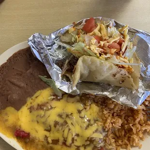 Enchilada plate with a puffy taco